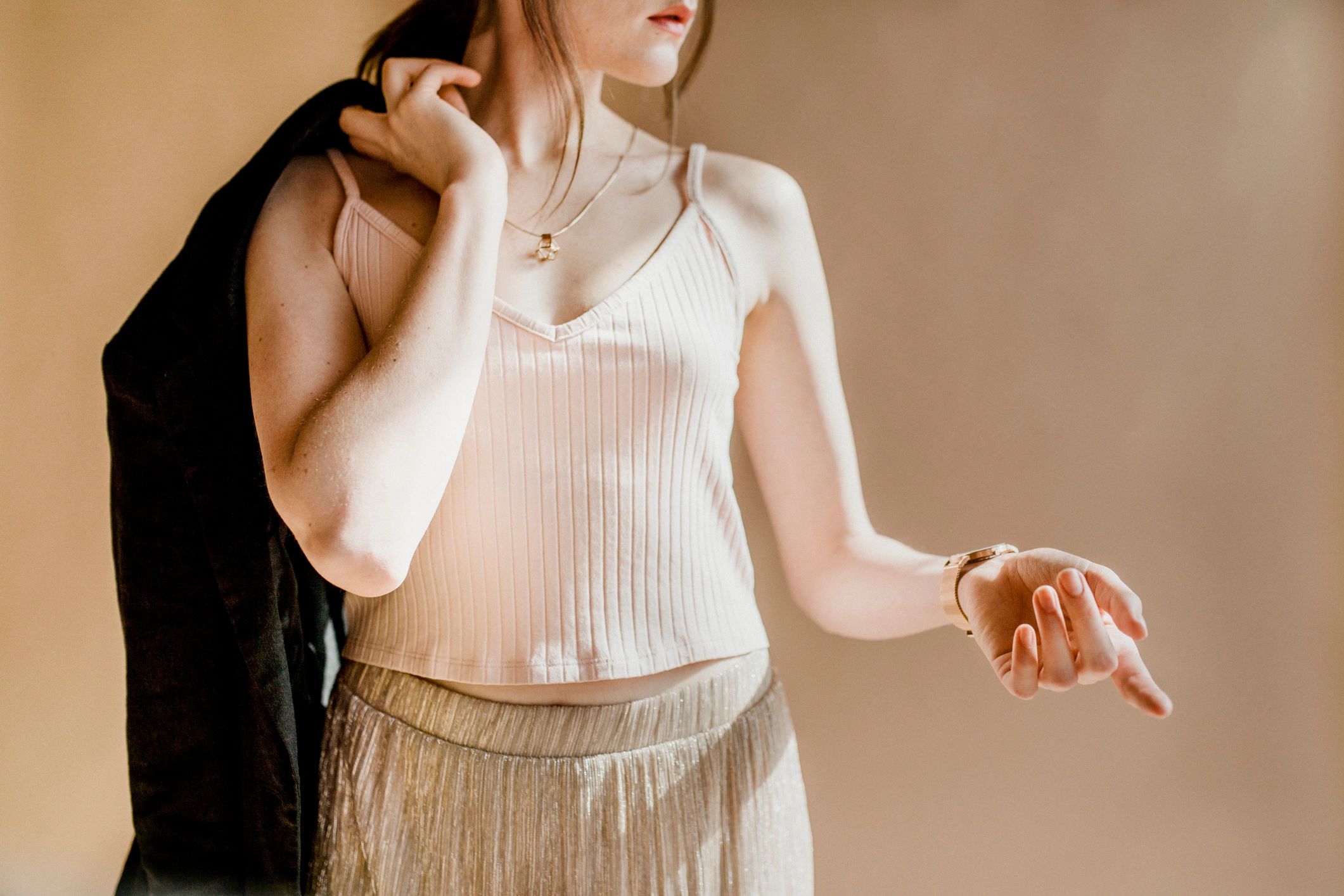 Woman in a soft, versatile top and relaxed trousers
