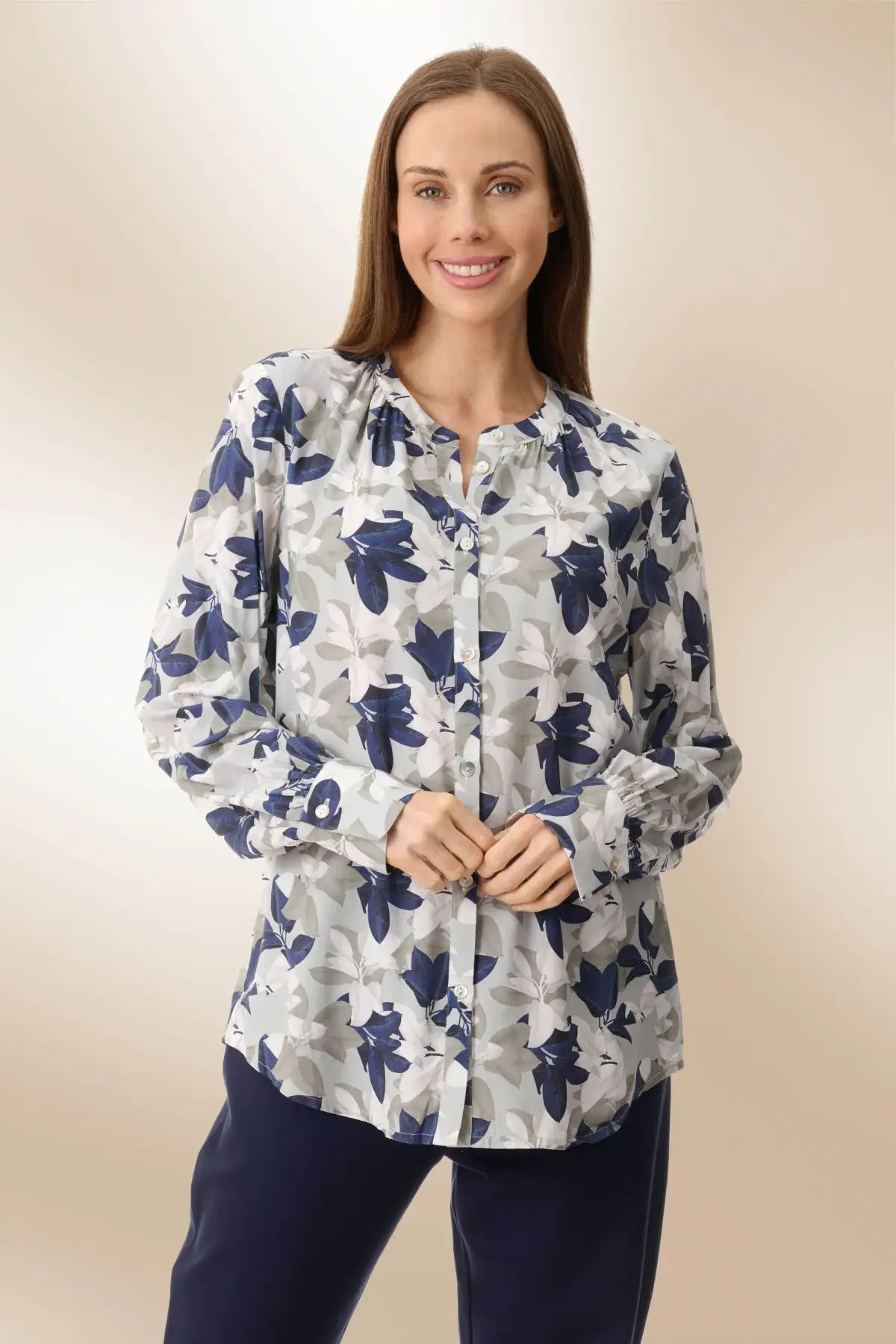 Woman wearing a Givoni floral blouse.